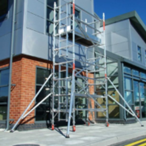 Main entrance of a building setup with scaffolding for renovation
